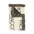 Floral-patterned rug with a decorative border on a white background