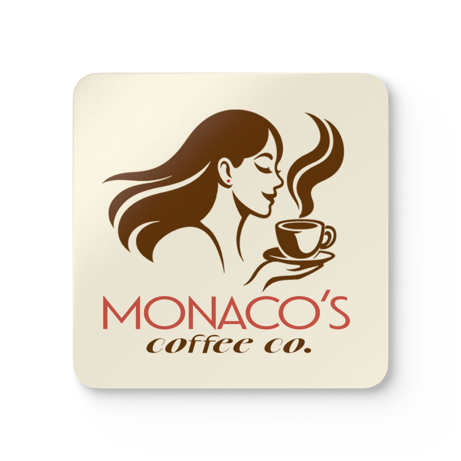 A square cream-colored coaster or tile with rounded corners, featuring a brown line-art illustration of a woman holding a steaming coffee cup, with the text 'MONACO'S coffee co.' in red and brown below.
